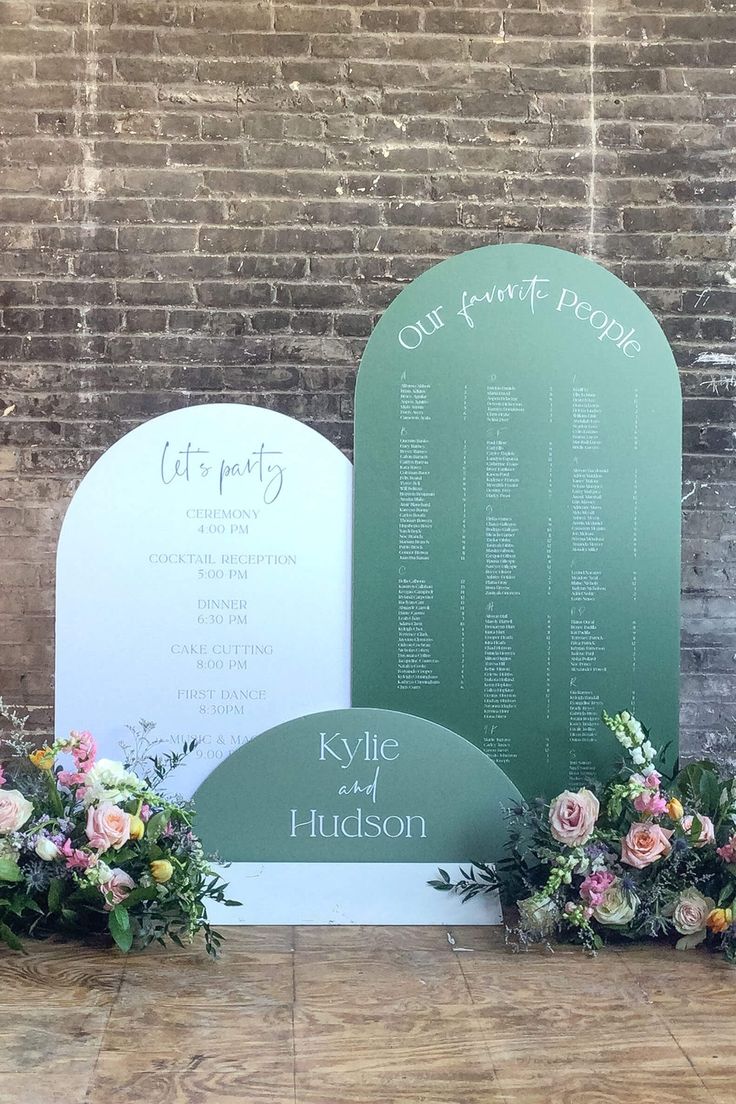 flowers are placed in front of the ceremony sign