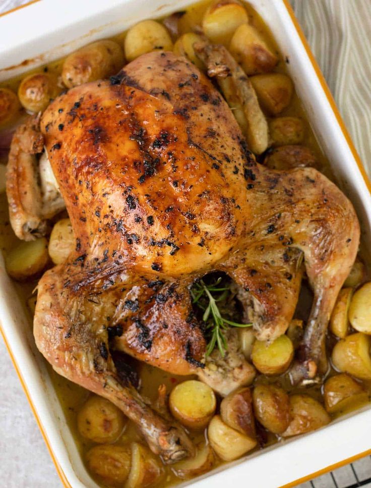 roasted chicken and potatoes in a casserole dish