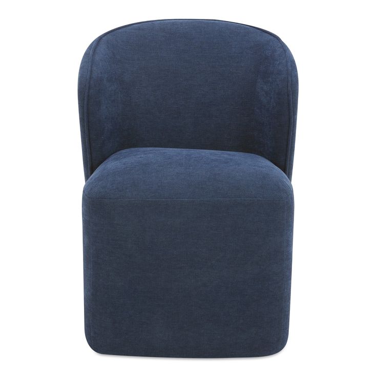 the large blue chair is upholstered and ready to be used