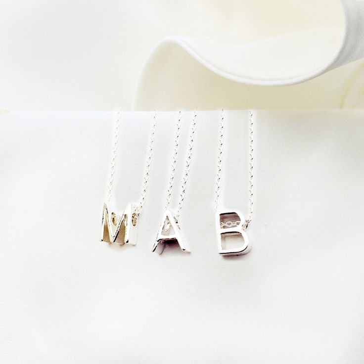 Elevate your everyday style with our Personalized Tiny Monogram Necklace! This initial charm necklace is the perfect way to show off your unique style and personality. Whether you choose your own initial or that of a loved one, this necklace is a beautiful way to add a personal touch to any outfit. Plus, it makes a wonderful gift for women who love simple, elegant jewelry. Please choose your letter at checkout. This necklace can be made of  one, two or three letters of your choice and one or two Sterling Silver Initial Pendant Charm Necklace For Gift, Sterling Silver Monogram Charm Necklace For Mother's Day, Mother's Day Sterling Silver Monogram Charm Necklaces, Mother's Day Sterling Silver Initial Pendant Charm Necklace, Silver Custom Name Charm Necklace For Everyday, Mother's Day Sterling Silver Charm Necklaces, Mother's Day Sterling Silver Monogram Charm Necklace, Everyday Silver Charm Necklace With Custom Name, Everyday Silver Necklace With Custom Name