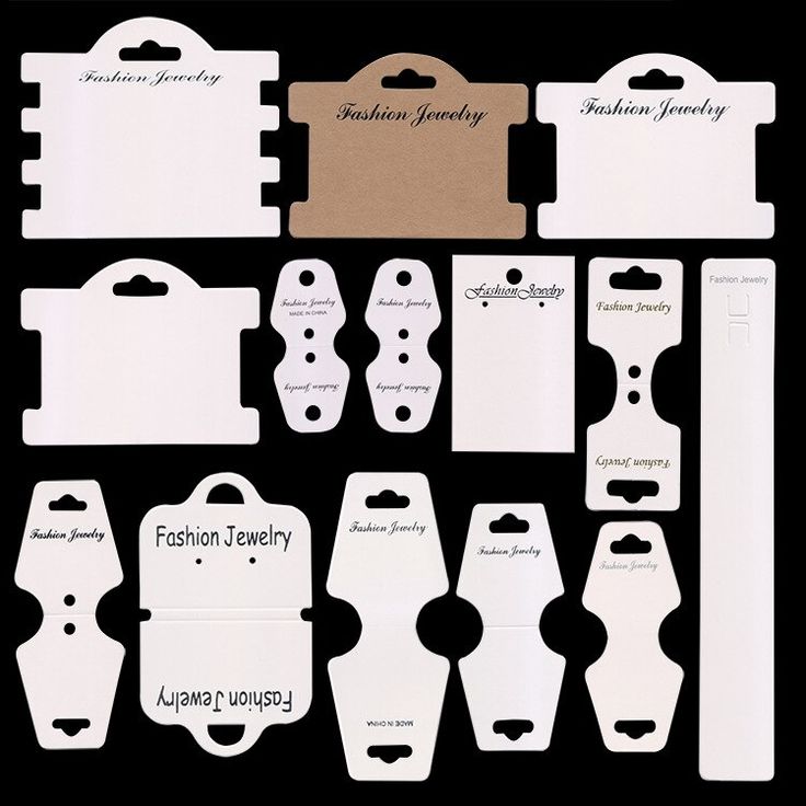 paper cutouts and tags for clothing, jewelry or accessories on black background with white lettering