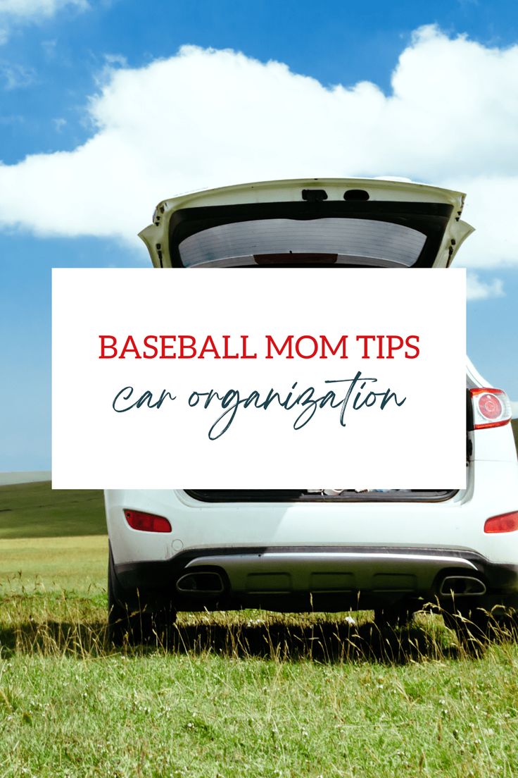 a baseball mom tips car organization sign in the back of a white car on a grassy field