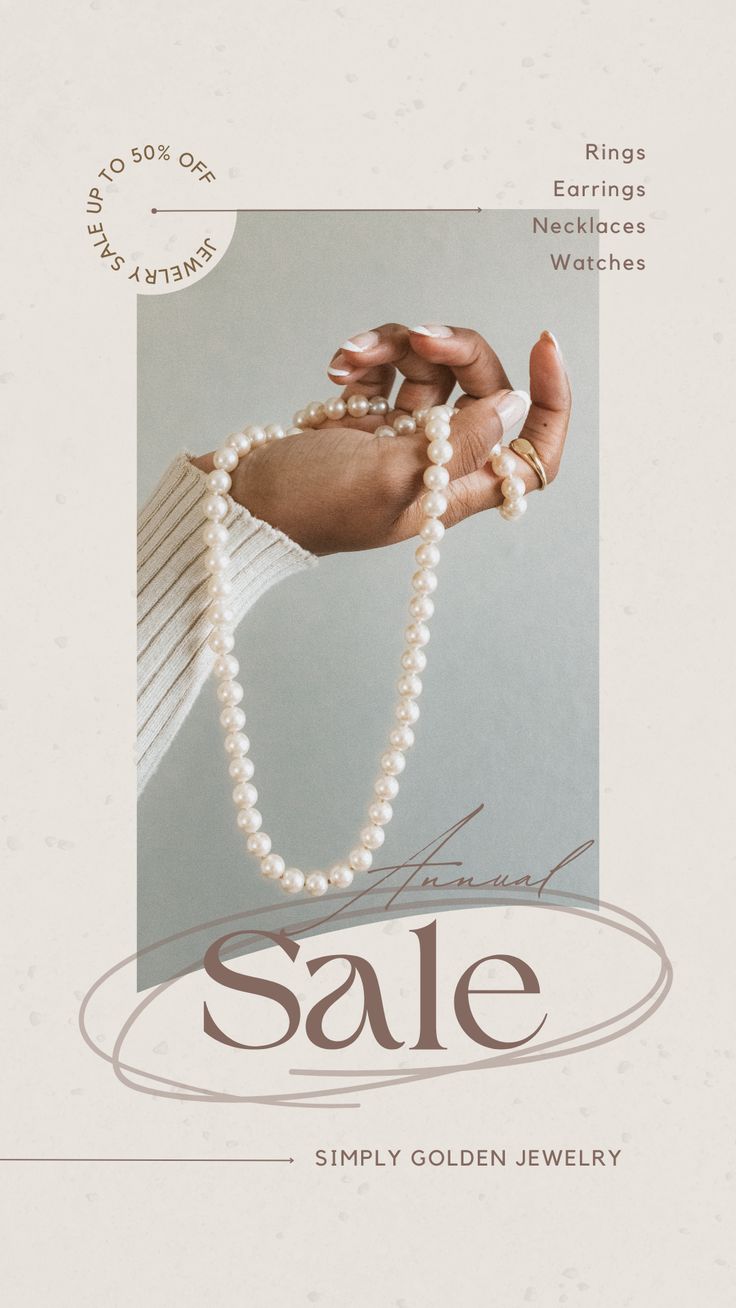 a woman's hand holding a strand of pearls with the word sale written on it