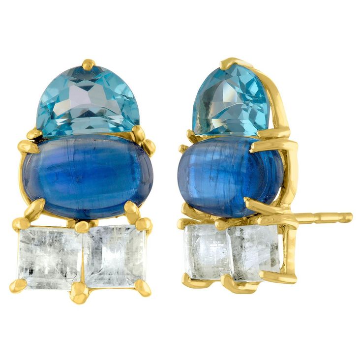 Cool colors are the story in this design. These stud earrings feature multi-shaped stones. Icy blue Topaz squares are set against deep Kyanite ovals and blue Topaz half moons. Interesting in both shape and color, these are fashionable stud earrings, perfect for everyday to evening style. Materials: 14 Karat gold, Kyanite, Moonstone, Blue Topaz Dimensions: 8mm x 13mm Journal Jewelry, Jewelry Artist, Cool Colors, Icy Blue, Mid Century Modern Furniture, Handbag Shoes, Artistic Jewelry, Metal Jewelry, Jewelry Earrings Studs