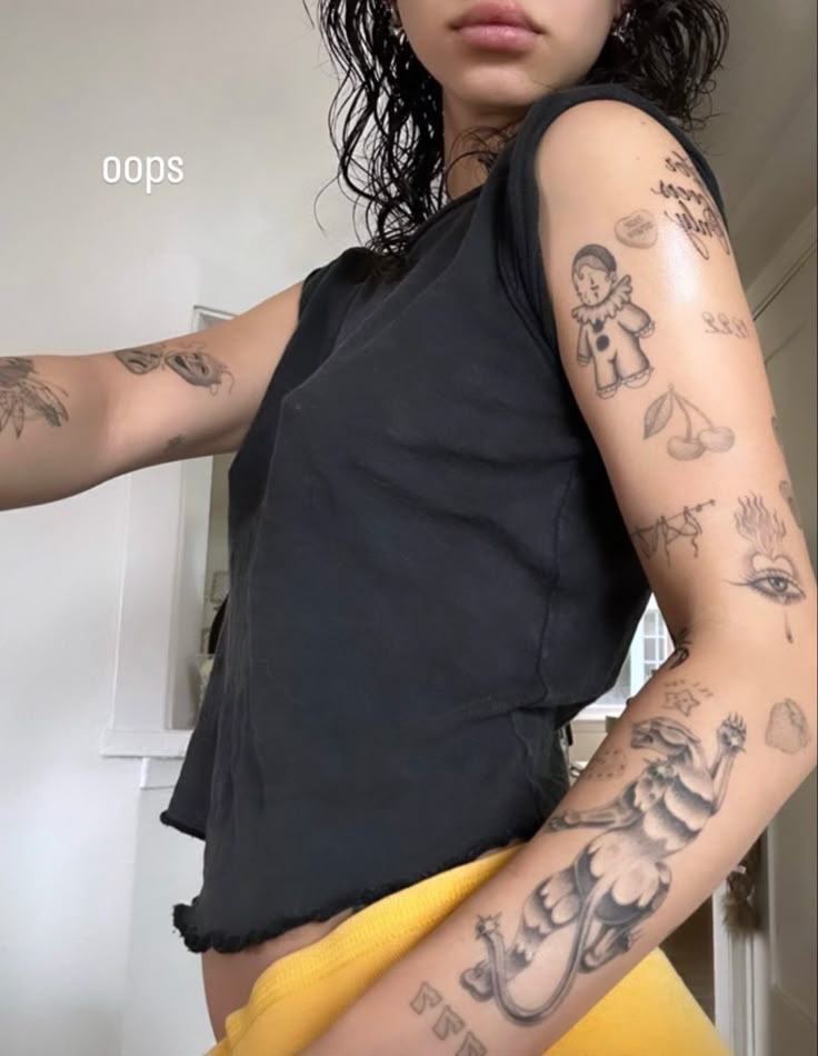 a woman with many tattoos on her arm