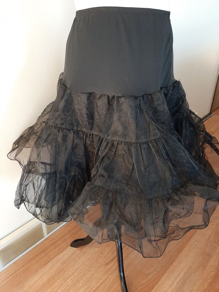 "Vintage Womens Black Nylon Full Circle Petticoat Slip/ Pin Up Rockabilly Half Slip Size M-L Very Good Vintage Condition. No Rips, Tears Or Stains. Elastic Has Probably Lost Some Of It's Stretch. If Replaced Could Fit A Size Small Also. .5\" Elastic Nylon Stretchy Top Section 2 17\" Tiered Stiff Nylon Ruffled Sections Nylon Undercoat Waist 30\"-43\" Hips 50\" Length 26\"" Chenille Quilt, Coverall Jumpsuit, Square Dance, Chenille Bedspread, Square Dancing, Half Slip, Stretchy Tops, Bib Overalls, Full Circle