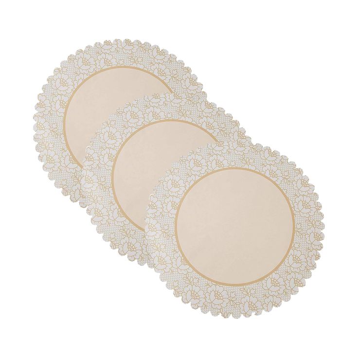 three white doily plates with gold trim