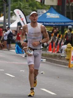 a man running down the road in a marathon