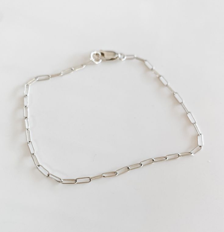 The most beautiful dainty Jenni mini silver paperclip chain! sterling silver Sterling Silver Delicate Chain Bracelet For Everyday, Everyday Sterling Silver Delicate Chain Bracelet, Sterling Silver Bracelet With Silver Chain For Everyday Wear, Everyday Silver Link Chain Bracelet, Simple Cable Chain Link Jewelry, Silver Oval Link Bracelets For Everyday, Minimalist Everyday Cable Chain Jewelry, Everyday Minimalist Cable Chain Jewelry, Trendy White Gold Jewelry For Everyday