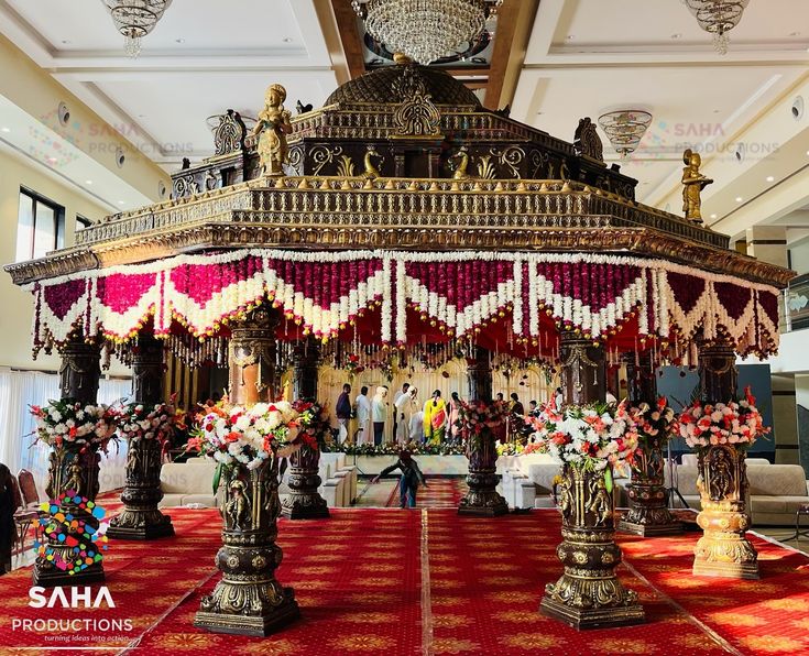 an elaborately decorated gazebo in the middle of a room