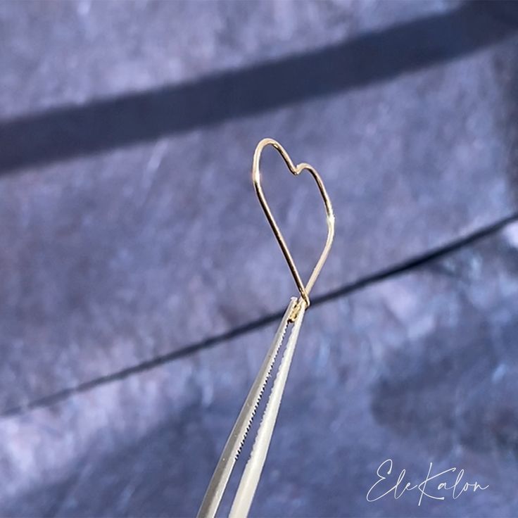 Lightweight, open heart-shaped wire hoop earrings handcrafted in 10K solid gold. Treat yourself with some love. Ships within 3 business days. - Earring size: 18mm - Wire thickness: 0.7mm - Sold as A Pair. - Made in 10 karat gold. - Stamp with 10K. 14k Gold Open Heart Pierced Earrings, Yellow Gold Open Heart Earrings, Minimalist Yellow Gold Open Heart Earrings, Gold Paperclip Hoop Earrings As Gift, Gold Small Hoop Heart Earrings In Minimalist Style, Gold Minimalist Hoop Heart Earrings, Minimalist Gold Hoop Heart Earrings, Gold Open Heart Dainty Hoop Earrings, Minimalist Gold Small Hoop Heart Earrings