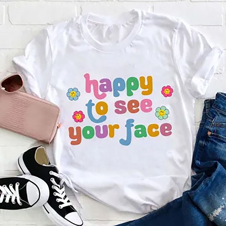 ✔️ TITTLE : Happy To See Your Face Teacher T-Shirt, Teacher Life Shirt, Kindergarten Shirt, Teacher Shirt, Gift For Teacher ✔️ IMPORTANT: Both Men and Women can we our shirts because this is unisex style t-shirts; Wash item inside out in cold water, do not bleach, do not dry clean, do not iron directly on the design. ✔️ MATERIAL DETAILS: 5.3-ounce, 100% cotton (99/1 cotton/poly (Ash) & 90/10 cotton/poly (Sport Grey); Heavyweight classic unisex tee; Taped neck and shoulders; Tearaway label ;Decor White Quote Print T-shirt For Summer, Playful Slogan T-shirt With Crew Neck, Playful Slogan Crew Neck T-shirt, White Summer T-shirt With Quote Print, Cute Slogan T-shirt With Crew Neck, Cute Slogan Crew Neck T-shirt, Playful White T-shirt With Funny Text, Playful Letter Print T-shirt With Crew Neck, Playful Crew Neck T-shirt With Text Print