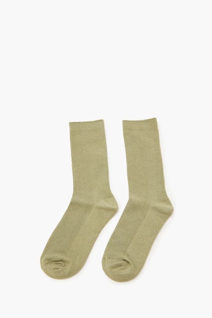 Pair of knit crew socks featuring ribbed construction. | 76% cotton, 22% polyester, 2% spandex | Hand wash cold | Ribbed Crew Socks Trendy Ribbed Stretch Socks, Solid Stretch Cotton Socks, Cotton Knee-high Socks For Spring, Comfortable Ribbed Casual Socks, Solid Cotton Knee-high Socks For Spring, Stretch Solid Color Cotton Socks, Comfortable Casual Ribbed Socks, Casual Solid Socks, Casual Solid Color Everyday Socks