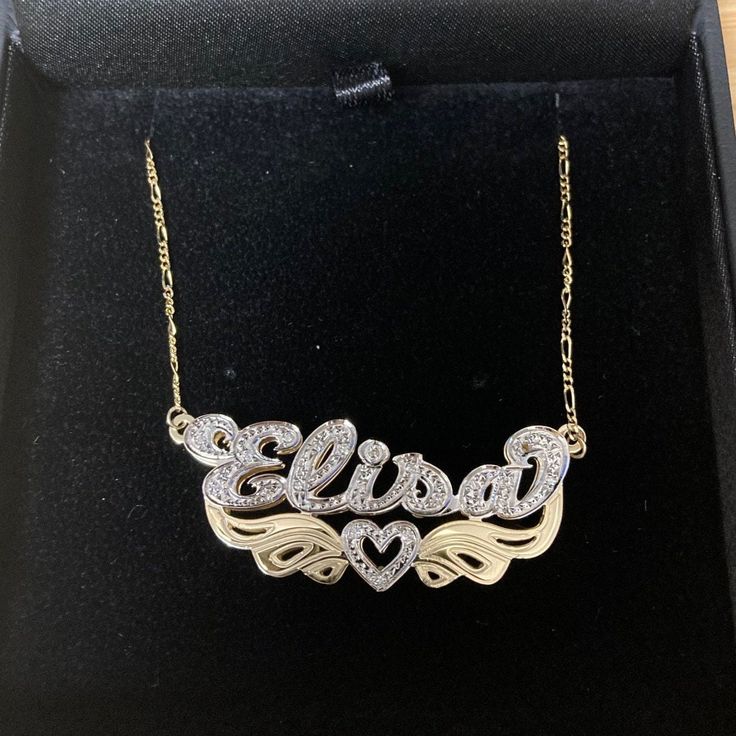 "Stand out and make a statement with our fully loaded double plated name necklace collection. Personalize your necklace with your name or a special word below. Letters and heart are studded with 20 sparkling quality cz crystal set on rhodium cut. Rhodium is 7 times more expensive than gold and it does not tarnish and gives a brilliant shine which makes stone sparkle more. This necklace comes with a Free Figaro Chain. 💖 Item Specification 💖 Material: 925 sterling silver solid The Name Necklace Custom Name Diamond Nameplate Jewelry, Gold Sterling Silver Name Necklace With Diamond Accents, Silver Nameplate Necklace With Diamond Accents, Gold Nameplate Necklace With Diamond Accents, Silver Cubic Zirconia Nameplate Necklace, Anniversary Cubic Zirconia Nameplate Jewelry, Gold Custom Name Necklace With Cubic Zirconia, Personalized Cubic Zirconia Nameplate Necklace, Gift Nameplate Necklace With Diamond Accents