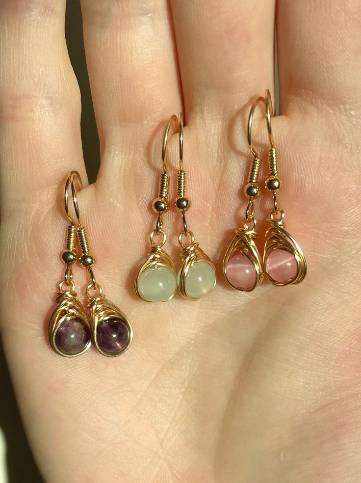 These earrings are made with elegant, light gold earring hooks, tarnish resistant 22 gauge light gold wire, and various genuine crystal and gemstone beads! The earrings come with a set of silicone earring backs to keep them in place. Thank you for stopping by and checking out my shop! I appreciate you <3 Free US shipping on all orders over $35 :) All pieces are handmade with love and care in Boone, NC <3 Wire Earrings Designs, Crystal Wire Wrap Earrings, Wire Gold Ring, Homemade Wire Earrings, Crystal Wrapped Earrings, Wire Wrapped Pearl Earrings, Wire Wrapped Gemstone Earrings, Elegant Wire Jewelry, Earrings Wire Wrapped