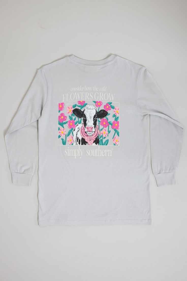 This Simply Southern Youth Long Sleeve Flowers Cow T-Shirt for Girls in White Water is perfect for this Fall weather. This shirt features an adorable graphics, long sleeves, and lightweight construction. Features: Simply Southern Style: YTH-LS-COW-WHITEWATER Color: White Water 100% Cotton Simply Southern Shirts Long sleeves, crew neckline Simply Southern logo tag on hem Simply Southern logo and bow graphic on the left chest On the back: Cow and flower graphic and reads, “consider how the wild flowers grow” with the Simply Southern logo Measurements from size youth small: Length from back shoulder: 23” Chest: 34” Machine wash cold, tumble dry low Kids Simply Southern Shirts, Cute Long Sleeve T-shirt For Spring, Spring Long Sleeve Graphic T-shirt, Spring Funny Print Long Sleeve Tops, Spring Long Sleeve Tops With Funny Print, Spring Long Sleeve T-shirt With Funny Print, Long Sleeve Cotton T-shirt With Funny Print, Long Sleeve T-shirt With Text Print For Spring, Long Sleeve Text Print T-shirt For Spring