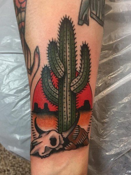 a cactus with a skull on it is shown in this tattoo design by the artist