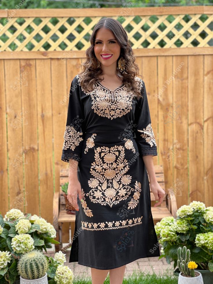 This Beautiful Floral Golden Embroidered Dress is the perfect formal dress. It's embroidered from top to bottom with gold florals and has details in lace and crochet. It also has ties in the back of the dress for a tighter look if desired. Please Note: You may purchase the dress with a belt for a special price or you can purchase the dress without the belt. Purchase the Gold plated Filigree Earrings here: https://www.etsy.com/es/listing/855938626/aretes-mexicanos-de-filigrana-aretes?ref=listings V-neck Embroidered Dress For Eid, Festive V-neck Embroidered Dress, Black Floral Embroidered Dress For Eid, V-neck Party Dress With Resham Embroidery, Festive V-neck Dress With Intricate Embroidery, Embroidered Black Dress For Eid, V-neck Dress With Intricate Embroidery For Eid, V-neck Floral Embroidered Dress For Eid, Black Tunic Dress For Festive Occasions