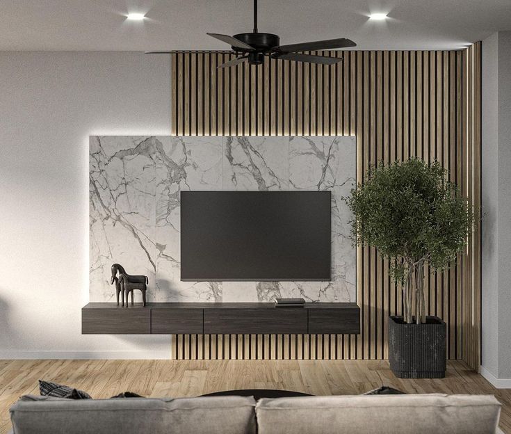 a modern living room with marble and wood accenting the walls, tv on an entertainment center