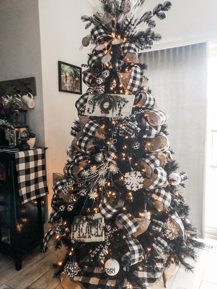 a black and white christmas tree decorated with ornaments