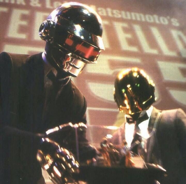 two mannequins dressed in suits and helmets stand next to each other