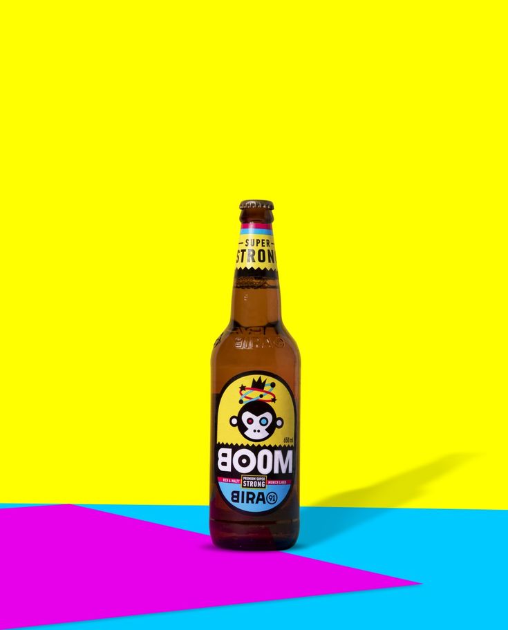 a bottle of moob beer on a multicolored background