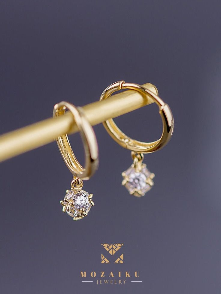 Diamond pavé creates a perfect droplet for these buckle earrings, which are the signature collection of Mozaiku. Now you can choose in either 14K or 9K gold Specification: Precious Metal Condition : 9K Gold / 14K Gold Purity : 14k yellow gold, 9K yellow gold Stone : Zircon Custom made Gold Drop Hoop Earrings Fine Jewelry, Gold Huggie Diamond Earrings For Formal Occasions, Elegant Gold Huggie Earrings With Prong Setting, Yellow Gold Dangle Earrings With Prong Setting, Gold Teardrop Huggie Earrings In Cubic Zirconia, Gold Teardrop Huggie Earrings With Cubic Zirconia, Gold Teardrop Diamond Hoop Earrings, Elegant Teardrop Huggie Earrings With Lever Back, Gold Earrings With Diamond Accents In Round Cut