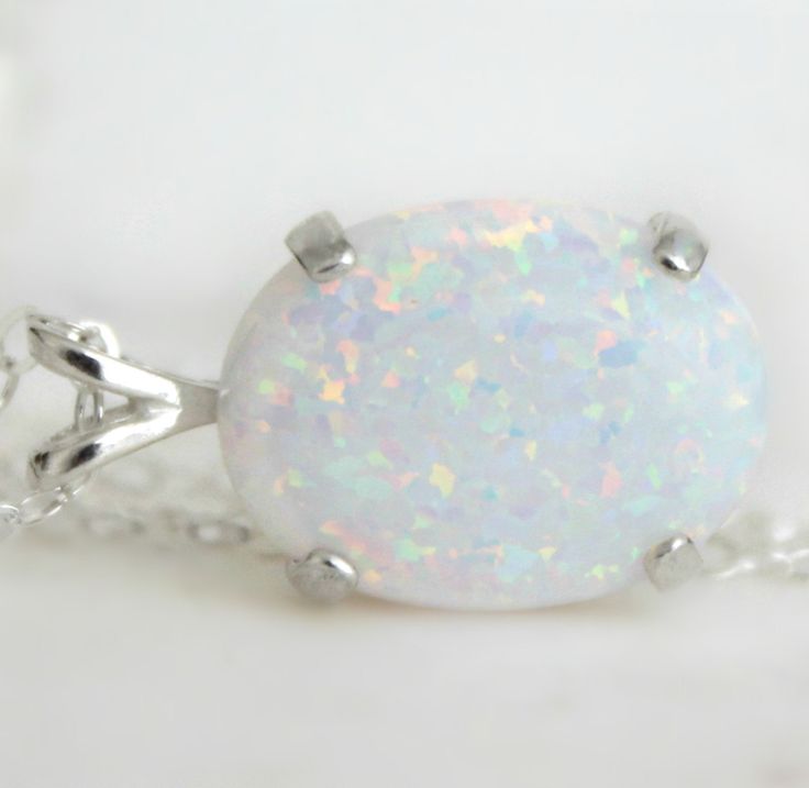 "Beautiful Large white lab-created opal pendant necklace. These gorgeous opals are very similar to natural mined opals. Lab-created opals contain 70-90% silica (from which natural opal is formed) and 10-30% resin. The resin makes the opal harder, stronger, unlike natural opals, which are known to be soft and fragile. Each opal displays a rainbow of color that sparkles with every catch of light. I've handset two different size opals in a solid sterling silver prong settings 16x12mm (5/8\" x 1/2\" Hair Items, October Birthstone Jewelry, Jewelry Opal, Necklace Opal, Opal Pendant Necklace, Mom Day, October Birthstone, Opal Pendants, Opal Necklace