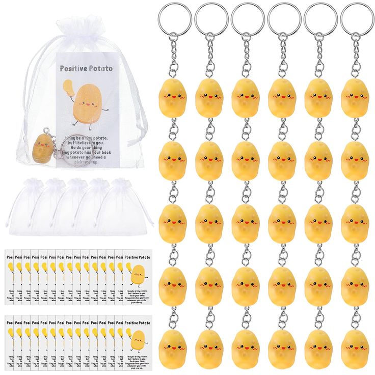 a bunch of little yellow chicks are in front of a clear bag and some key chains