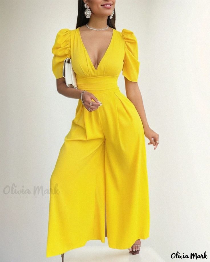 Olivia Mark - Wide Leg Jumpsuit with Puffed Sleeves and Plunge Neckline Chic Puff Sleeve Bodysuit For Spring, Chic Spring Bodysuit With Puff Sleeves, Solid Color Short Sleeve Bodysuit For Party, Fitted Puff Sleeve Jumpsuits And Rompers For Summer, Elegant Yellow Fitted Jumpsuits And Rompers, Elegant Fitted Yellow Jumpsuits And Rompers, Yellow Jumpsuit For Party, Elegant Fitted Yellow Jumpsuit, Elegant Solid Color Bodysuit For Spring