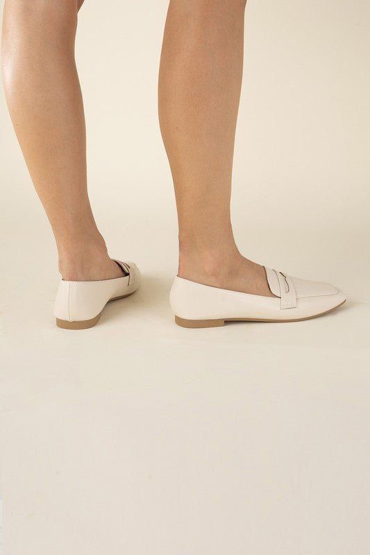 Put your feet up in style with the Harriet Loafers. These classic casual flats offer a comfortable and trendy alternative to heels. With a playful, relaxed tone, these simple yet chic flats are perfect for any casual occasion. Loafers fit true to size Comfortable Beige Flat Loafers, Casual Almond Toe Flats With Rubber Sole, Summer Business Casual Round Toe Loafers, Summer Business Casual Loafers With Round Toe, Casual Closed Toe Flats For Work, Casual Flat Slip-ons For Office, Spring Business Casual Slip-ons, Casual Ballet Flats With Almond Toe And Branded Insole, Beige Spring Loafers With Flat Heel