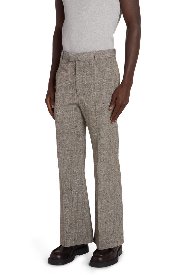 The visibly rich texture of a silk-kissed mélange fabric perfectly complements the comfortable regular-fit cut of these pants polished by pressed creases. A signature V-flap at the back welt pocket instantly yet subtly identifies the brand. 31 1/2" inseam; 24" leg opening; 14 1/2" front rise (size 48 EU) Zip fly with hook-and-bar tab closure Side-seam pockets; back button-welt pocket 62% viscose, 38% silk Dry clean Made in Italy Designer Clothing Modern Fitted Beige Wide Leg Pants, Luxury Beige Trousers, Luxury Fitted Beige Bottoms, Beige Wide Leg Tailored Pants, Beige Wide Leg Bottoms For Tailoring, Rich Textures, Welt Pocket, Bottega Veneta, White Blue