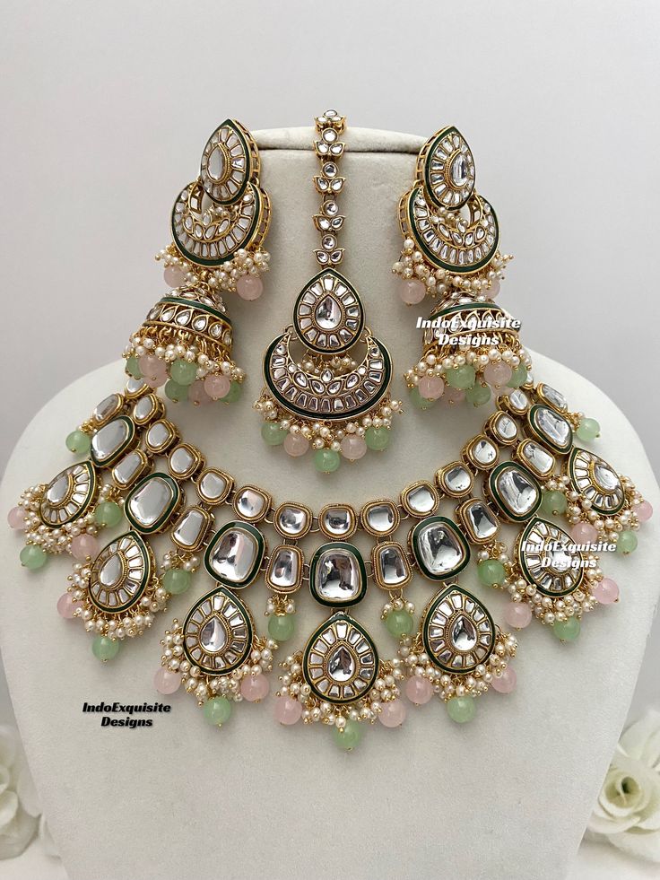 Premium quality Kundan Necklace comes with elegant Jhumki Earrings and Tikka/ trendy Indian bridal set/Premium Quality Polki and Kundan Jewelry/pink pista/pink mint/pink sage green  All items are shipped from Brampton, Ontario, Canada. If you need your item by a certain day, please reach out to us for express delivery option before placing the order so that we can update the shipping for you. Standard shipping/delivery timeline Below are the delivery timeline estimates. We dispatch all orders by Wedding Jewellery Designs, Brampton Ontario, Indian Wedding Jewelry Sets, Necklace Set Indian, Kundan Jewelry, Fancy Jewellery Designs, Jhumki Earrings, Indian Jewelry Sets, Kundan Necklace