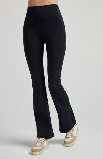 These leggings feature a high-rise waistband and a flirtatious flare below the knee, evoking memories of carefree days. Crafted from our high-performance SculptLux fabric, they wrap you in a luxurious second-skin embrace, offering support that allows you to move gracefully through life's every step. At LOSANO we help elevate every moment with clothing that is better for you! High waist Bootcut flare Sculpting Moisture wicking UV protective PFA Free BPA free Made from sustainable materials Oeko-t High Rise Stretch Bottoms With Elastic Waistband, High Rise Compressive Elastane Pants, Fitted Flare Yoga Pants For Spring, Flare Stretch Bottoms For Sports, Compressive High Rise Athleisure Bottoms, High-rise Fitted Activewear With Elastic Waistband, Stretch Flare Pants For Workout, Mid-rise Elastane Gym Pants, Chic Full-length Yoga Pants