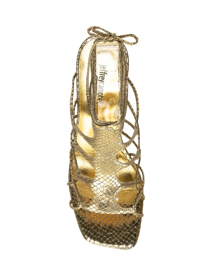 Gold sandal with heel. Round heel with rhinestones. Closure with ankle laces. Band with snake print on the front.Composition: Outside:, 100% Rubber Lining:, 100% Leather Sole:, 100% Rubber Gold Lace-up Sandals With Wrapped Heel For Evening, Luxury High Heel Lace-up Sandals For Party, Luxury Lace-up Sandals For Spring, Gold Lace-up Sandals For Evening, Luxury Lace-up Summer Sandals, Gold Lace-up Sandals For Party, Luxury Lace-up Sandals For Summer, Luxury Summer Lace-up Sandals, Gold Lace-up Party Sandals