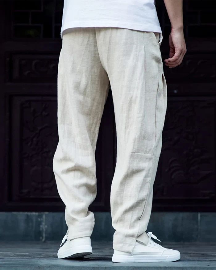 * Linen harem pants "Kamatsu" are in Asian size: Please choose at least one size larger than your usual size. Check the size guide for more details. Redefine Comfort with Linen Harem Pants "Kamatsu" Elevate your urban wardrobe with the Linen Harem Pants "Kamatsu". These pants are designed for those who value both style and comfort. The lightweight linen fabric and relaxed fit make these pants an ideal choice for warm weather or casual outings. Whether you're navigating the city or enjoying a lei Casual Harem Loungewear Bottoms, Casual Harem Lounge Bottoms, Casual Harem Bottoms For Loungewear, Casual Harem Sweatpants For Summer, Casual Summer Harem Sweatpants, Casual Harem Bottoms With Elastic Waistband, Casual Harem Bottoms With Pockets, Casual Loose Fit Ankle-length Harem Pants, Casual Solid Ankle-length Harem Pants