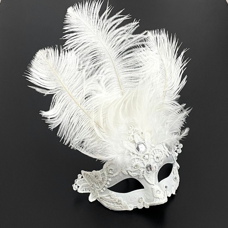 "Be the mysterious white mask at your party with this feathered mask with elastic band. This mask is sure to be a hit at a musical too!" Mask Ball Party, Feathered Mask, White Masquerade Mask, White Masquerade, Mask Ball, Mardi Gra, Silver Mask, Feather Mask, Party Mask