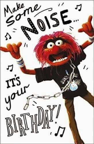 the muppet is wearing a black shirt and has his arms in the air