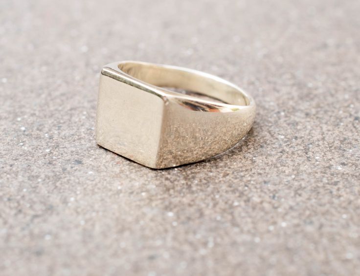 "International deliveries in 2-4 business days as standard shipping. A simple yet gorgeous silver signet ring. Material: Sterling silver 925 Width: 12 mm/0.47\" Finish: matte Top Dimensions: approx 12mm x 12mm/0.47\" X 0.47 \" It can be with a shiny finish or a matte finish. Please choose from the drop-down menu. It comes gift wrapped and ready for giving! ✿REGISTERED MAIL WITH TRACKING NUMBER ✿All of our jewelry are made to order. Allow for about a week for the jewelry to be made. ✿ keep in min Classic Silver Open Signet Ring, Classic Silver Rectangular Initial Ring, Silver Rectangular Initial Ring In Classic Style, Silver Rectangular Initial Ring Classic Style, Silver Classic Signet Ring For Promise, Classic Silver Signet Promise Ring, Minimalist Silver Engraved Ring For Formal Occasions, Minimalist Silver Signet Ring With Polished Finish, Simple Silver Sterling Silver Signet Ring