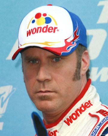 a man wearing a hat with the word wonder on it is standing in front of a blue wall