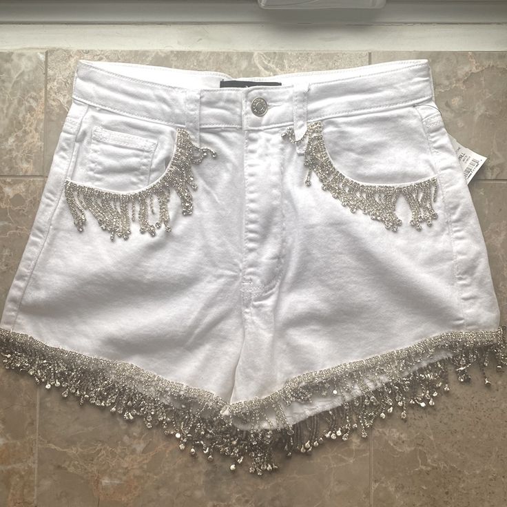 White Jean Denim Shorts With Rhinestone Fringe. New With Tags Size Small Embellished White Bottoms For Summer, White Embellished Bottoms For Summer, Summer White Embellished Bottoms, Summer Embellished Cotton Jeans, Summer Party Embellished Jeans, White Rhinestone Party Bottoms, Summer Party Jeans With Rhinestones, White Rhinestone Bottoms For Summer, Glamorous Summer Denim Bottoms