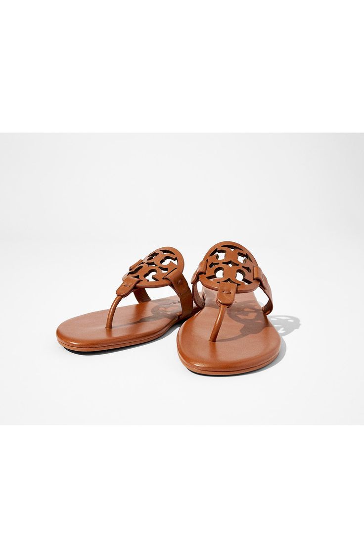 An iconic sandal with a cult following, the Miller is loved for its timeless style and exceptional comfort with a smooth leather toe post. The new design has a pared-down aesthetic, a seamless insole with extra padding and a supremely soft memory foam sole for long-lasting comfort and support. Cushioned insole Leather upper and lining/rubber sole Imported Classic Tan Sandals With Leather Lining, Classic Tan Sandals With Leather Sole, Classic Flat Sandals With Rubber Sole, Classic Toe Post Sandals With Leather Footbed, Classic Toe Post Sandals With Cushioned Footbed, Classic Sandals With Flat Heel And Rubber Sole, Luxury Leather Flip Flops With Single Toe Strap, Classic Tan Leather Sandals, Designer Sandals With Leather Footbed And Single Toe Strap