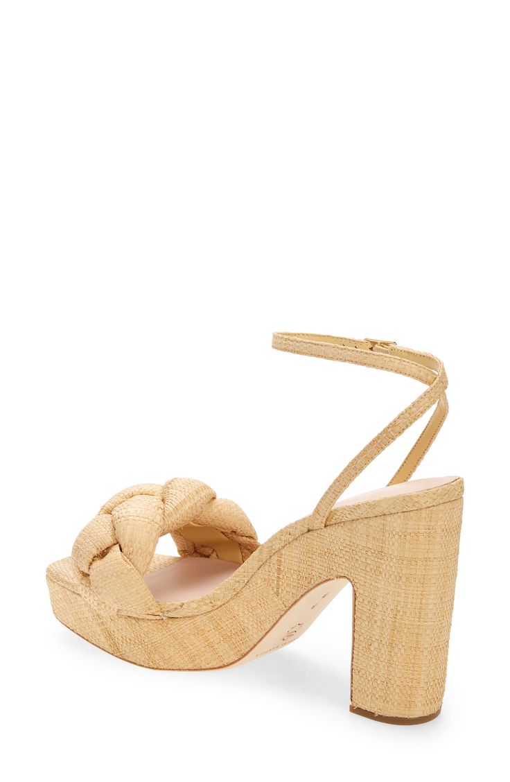 A boho-inspired platform sandal is accented with a chunky raffia braid across the toe and an adjustable ankle strap for a personalized fit. 4 1/4" heel; 1 1/2" platform Textile upper and lining/leather sole Imported Elegant Natural Platform Heels, Elegant Natural Color Platform Heels, Natural Straw Heels With Wrapped Heel, Chic Braided Open Toe Heels, Natural Ankle Strap Heels With Wrapped Heel, Natural Heels With Woven Sole And Ankle Strap, Natural Ankle Strap Heels With Woven Sole, Espadrilles Platform, Platform Espadrilles