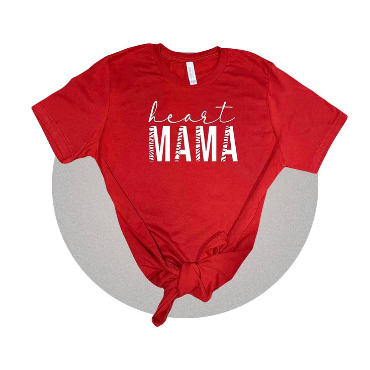 "This super cute new design is personalized and a perfect tee for any new heart mama out there. I wanted to create something minimalist but also stylish. My inspiration is certainly CHD Awareness but wanted to have fun with the graphic! I also wanted to get some red shirt designs out there with Heart Month quickly approaching us. This shirt is rocking the words \"Heart Mama\" in a stylish font.  Simple yet nice. It is a Unisex Jersey Bella Canvas 3001C that is 100% ringspun cotton and super comf Red Short Sleeve T-shirt For Gift, Red Graphic Print Top As Gift, Red Heart Graphic T-shirt With Short Sleeves, Red Short Sleeve T-shirt With Heart Graphic, Mother's Day Red Graphic Tee, Red Mother's Day Graphic Tee, Casual Red T-shirt For Mother's Day, Red Cotton T-shirt With Heart Print, Casual Red Heart-shaped T-shirt