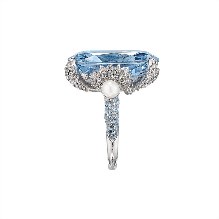 London-based Anabela Chan’s background in architecture and luxury fashion led to the first fine jewelry line to champion laboratory-grown gemstones. Today, its artisanal craftsmanship and sustainable innovations have found a place in the collections of royals, Rihanna, Taylor Swift, and sophisticated women worldwide. The Baby Blue Mermaid Ring features a breathtaking 18 carat simulated aquamarine at its center. Other stones feature pavé simulated white diamonds and cultured freshwater pearls. Pr Luxury Evening Rings With Gemstone, Luxury Oval Topaz Ring, Luxury Tanzanite Diamond Ring For Formal Occasions, Luxury Topaz Ring With Diamond Accents, Luxury Tanzanite Rings For Formal Occasions, Luxury Formal Tanzanite Ring, Luxury Sapphire Diamond Ring With Gemstone, Luxury Sapphire Diamond Ring With 17 Jewels, Luxury Sapphire Diamond Ring With Center Stone