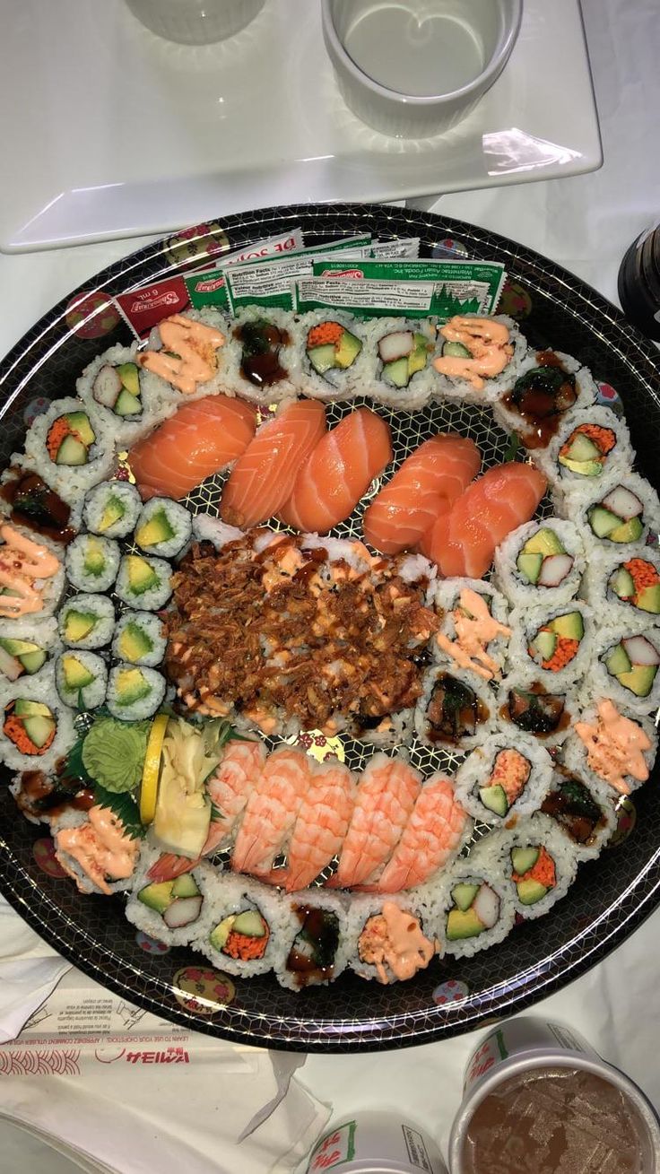 a platter filled with sushi and other foods