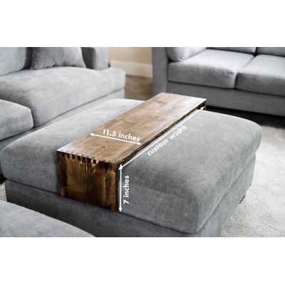 a couch and ottoman are shown with the measurements for each piece of furniture in front of it