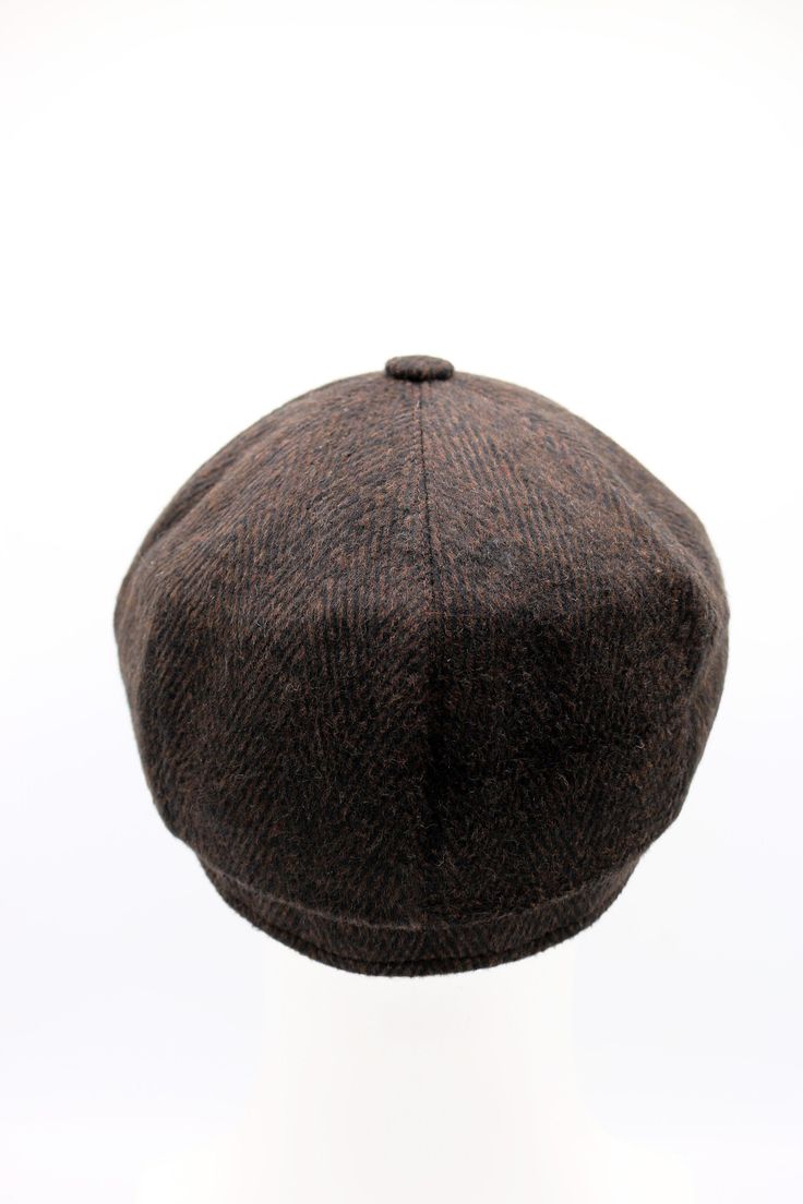 All baker boy caps are hand-crafted and made using the finest cashmere/wool. It has high quality stitches. A vintage style, this is inspired by the Peaky Blinders. It has 8 panels and on the top of the cap there is a decorative button. It is also great gift as well. Color : Dark Brown Material : %100 Wool All of our products are Free Express Shipping. Sizes : S: 54-55 cm M: 56-57 cm L: 58-59 cm XL: 59-60 cm Classic Wool Flat Cap Beret, Brown Wool Six-panel Hat, Classic Wool Hat, Classic Brown Baseball Cap With Flat Brim, Classic Brown Flat Brim Baseball Cap, Classic Brown Flat Cap, Classic Wool Beret With Short Brim, Vintage Brown Beret For Winter, Brown Flat Cap, One Size Fits Most