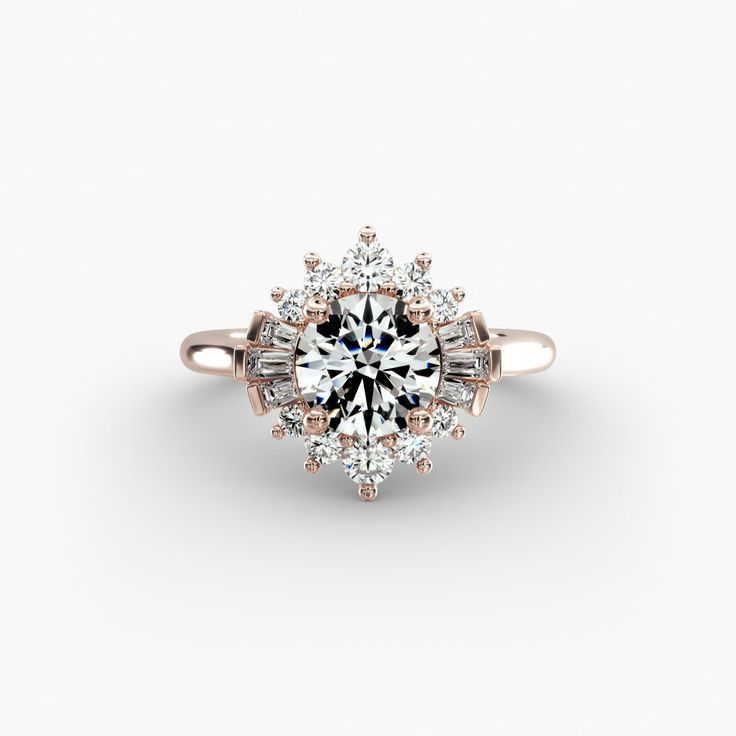 an engagement ring with diamonds on the side and a center stone surrounded by smaller stones