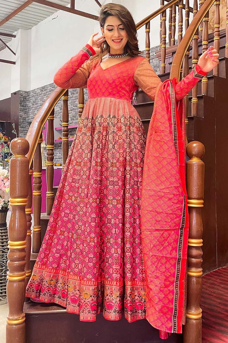 Flaunt Your Rich And Elegant Taste Wearing This Designer Readymade Long Gown In Fine Color. This Pretty Gown Is Fabricated On Chanderi And Dupatta Are Chandei Beautified With Digital Printed. Its Fabric Is Soft Towards Skin And Easy To Carry All Day Long. Product Features: Gown Color: Pink Dupatta Color: Pink Gown Fabric: Chanderi Dupatta Fabric: Chanderi inner Fabric: Cotton Crepe Work: Designer Digital Printed Wash: Dry Clean Occasion: Causal Product Type: Gown Disclaimer: There will be slight Fitted Multicolor Floor-length Anarkali Set, Festive Bandhani Print Georgette Dress, Festive Georgette Dress With Bandhani Print, Anarkali Dress With Pallu And Long Sleeves, Bollywood Style Bandhani Print Maxi Dress, Red Anarkali Gown With Long Sleeves, Bollywood Bandhani Print Maxi Dress, Orange Maxi Gown For Wedding, Red Long Sleeve Gown With Dupatta